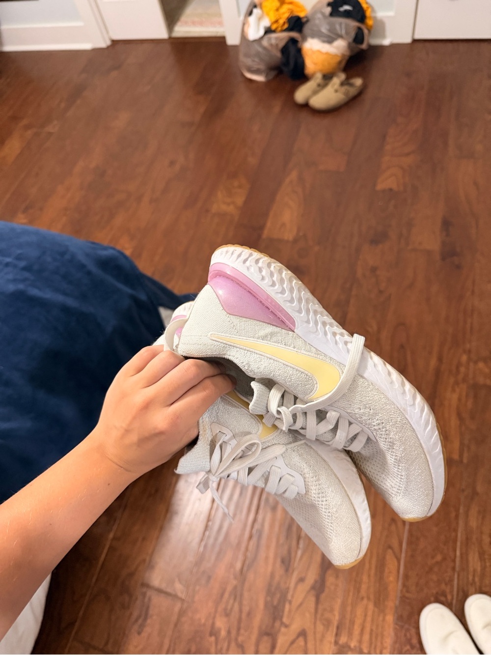 Nike White Knit Sneakers with Pale Yellow Swoosh and Pink Heel